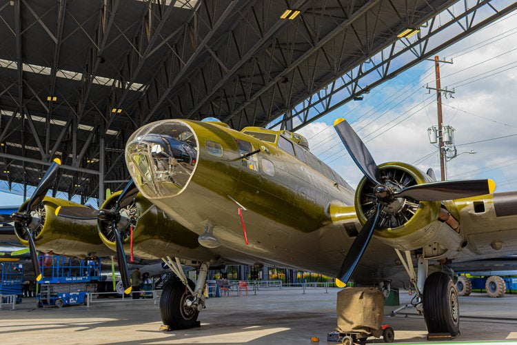 Beneath the expansive hangar, the vintage aircraft stands poised, its powerful frame echoing...