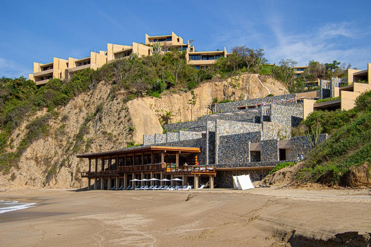 Perched gracefully on the rugged cliffs, the modern architecture of this coastal retreat harmonizes...