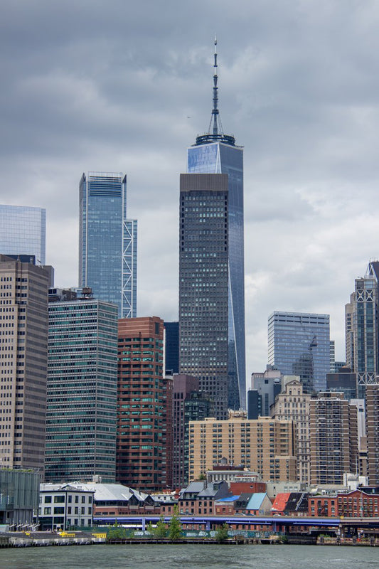 This striking image features the iconic skyline of Lower Manhattan, where towering skyscrapers...