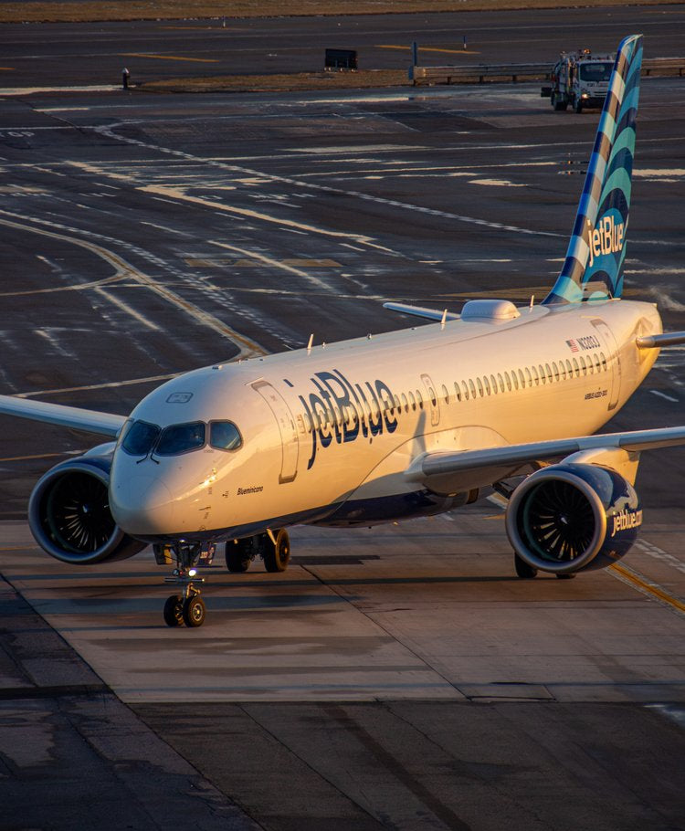 This striking image captures an aircraft basking in the warm glow of the golden hour, poised for...