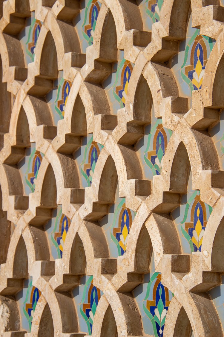 This captivating image showcases an intricate pattern of interlocking arches, each crafted from a...