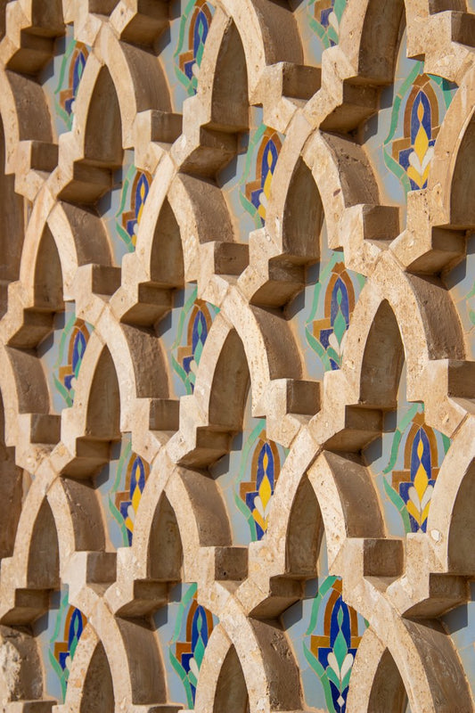 This captivating image showcases an intricate pattern of interlocking arches, each crafted from a...