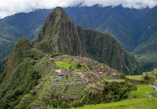 Perched high in the Andes, Machu Picchu emerges from the mist like a timeless sentinel of history