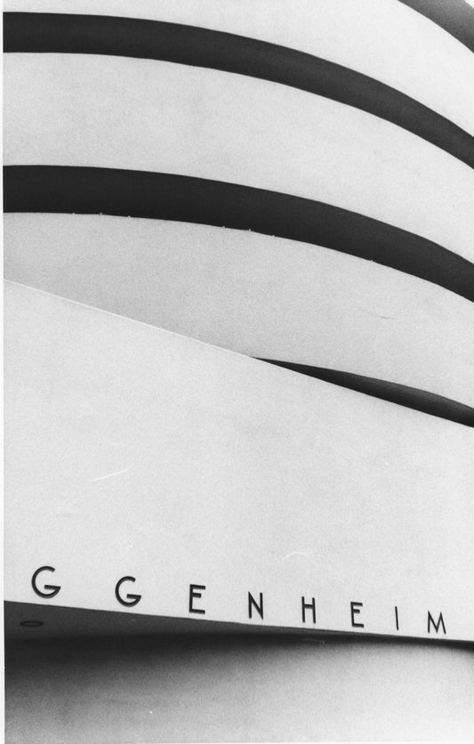 The iconic spirals of the Guggenheim Museum rise gracefully, captured in a monochrome palette that...
